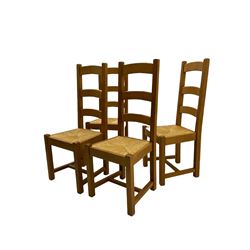 Set of six light oak dining chairs, with rush seats