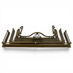 Three 20th century brass fenders, two with pierced Art & Crafts design rails, largest W156cm, D 45cm 