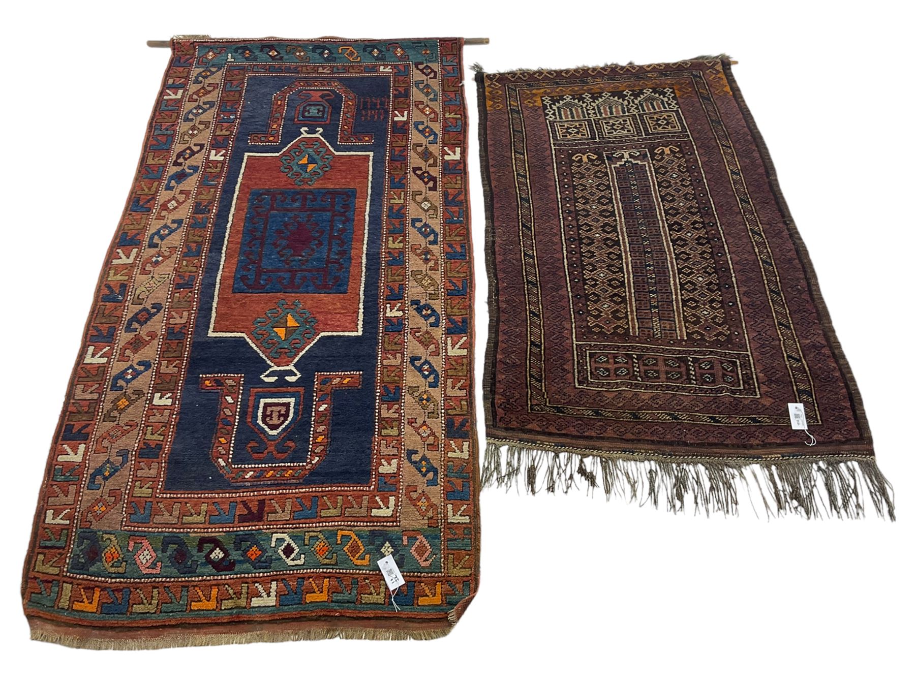 Turkish rug or wall hanging, blue ground field with decorative panels, with geometric motifs and multi-band border (207cm x 104cm), and a prayer rug with repeating border and geometric motifs (150cm x 92cm)