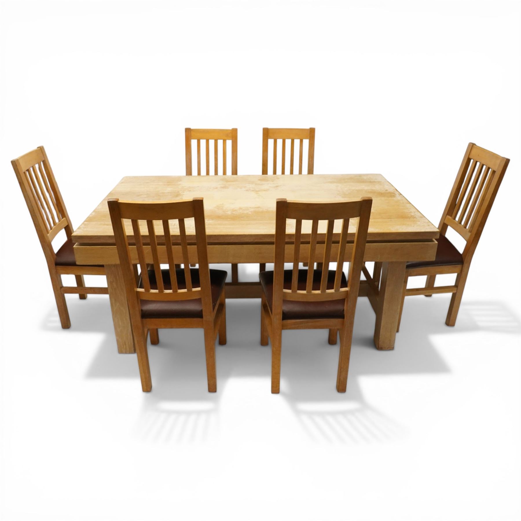 Late 20th century solid light oak refectory style dining table, rectangular top raised on square supports united by stretcher (W180cm D100cm H81cm); Set of six light oak high-back dining chairs with burgundy leather seats (W49cm H109cm)