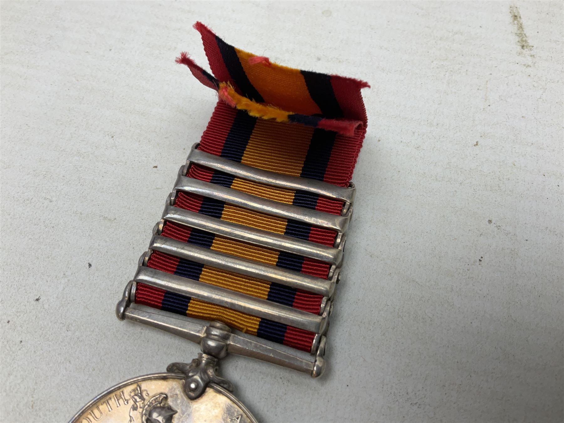 Queens South Africa Medal with five clasps for South Africa 1902/1901, Transvaal, Orange Free State and Cape Colony awarded to 4640 Pte. A. Farmer 1st Dgn. Gds. with ribbon and manuscript biographical details