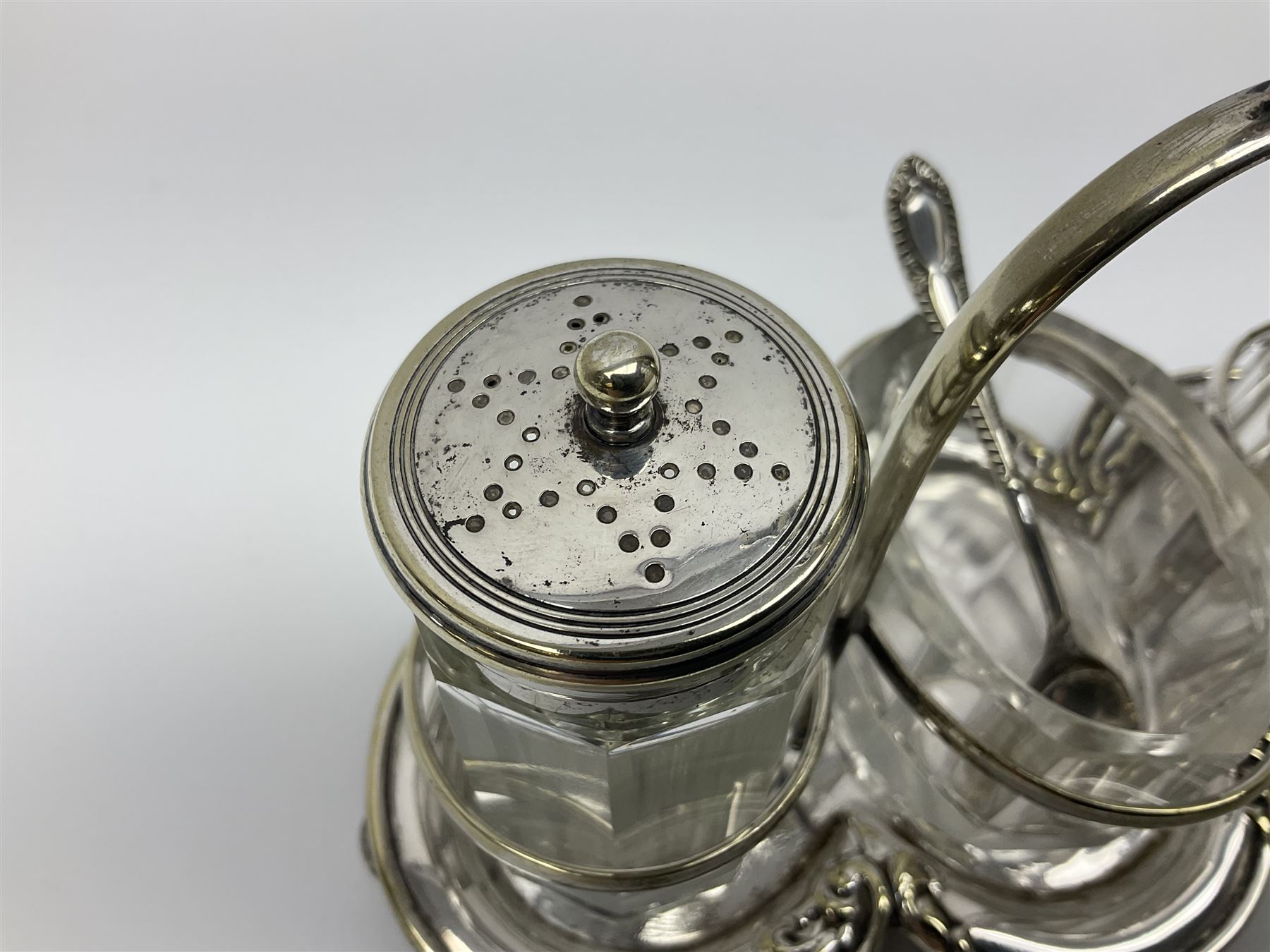 Sheffield silver-plated cruet set, comprising mustard pot, open glass salt and pepper pot on stand, together with a collection of silver plated spoons