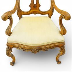 Pair of Italian carved walnut open armchairs, upholstered seats