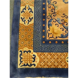  Chinese blue and salmon ground rug, central medallion, repeating border, 373cm x 274cm  