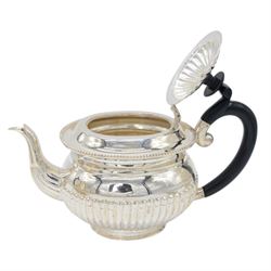 Late 20th century Indian Colonial silver six piece tea and coffee service, comprising coffee pot, hot water pot, teapot, milk jug, open sucrier and tray, all of oval part fluted form, the tea and coffee pot with ebonised wooden handles and finials, stamped SIL and with maker's mark for Cooke & Kelvey New Dehli, within two boxes and with original receipt for 1999