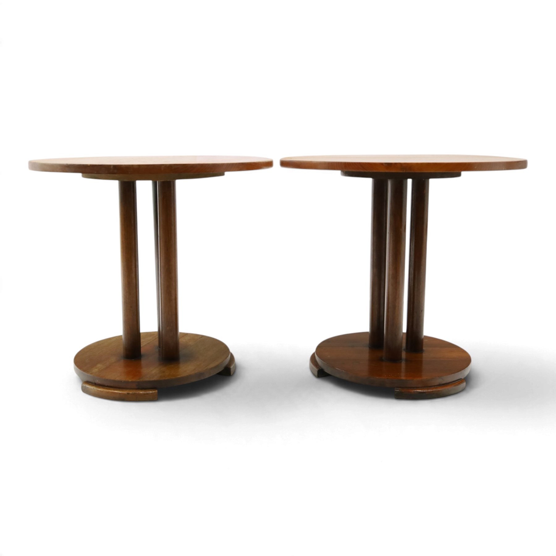 Pair of early 20th century oak lamp tables, circular tops raised on cluster-column pedestals, with circular platform bases and shaped bracket feet (2)