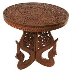 Carved side table, the top carved in relief with leaves and foliage, with folding legs, H53cm