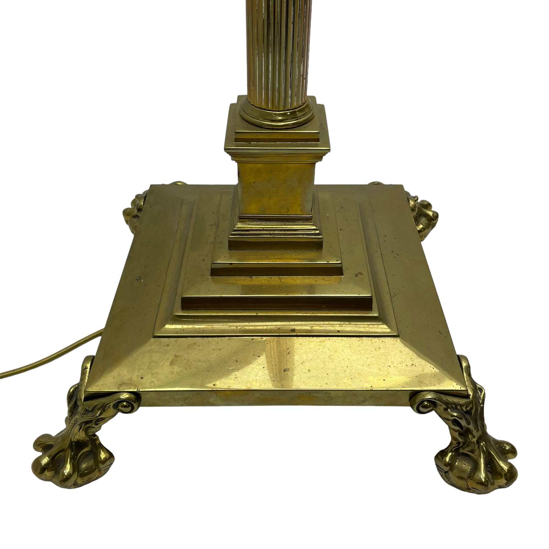 Late 20th century brass telescopic standard lamp in the form of a Corinthian column, Corinthian acanthus leaf capital over reeded shaft, stepped and moulded square base with four extending ball and claw feet