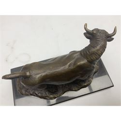 Bronze figure, modelled as a prancing bull, upon a naturalistic base signed Mils and with foundry mark, raised upon a rectangular marble base, overall H14cm