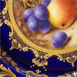 Royal Worcester Cabinet Plate, painted by Richard Sebright, the central panel decorated with fruit, within an elaborate gilt border on a cobalt ground, marked to base, D22cm 