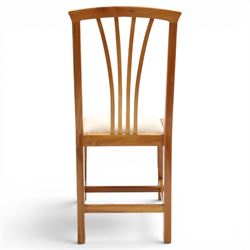 Knightman - set of nine cherrywood dining chairs, with fan splat backs and upholstered seats, raised on square legs joined by stretchers, comprising chairs of slight differing widths and one chair with turned front legs and orange upholstery and no Knight carving, the rest with recessed carved knight trademark, by Horace Knight of Old Mill Furniture, Balk near Thirsk 