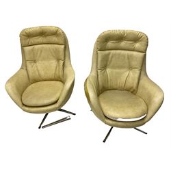 Parker Knoll - pair of swivel statesman chairs, circa. 1960s