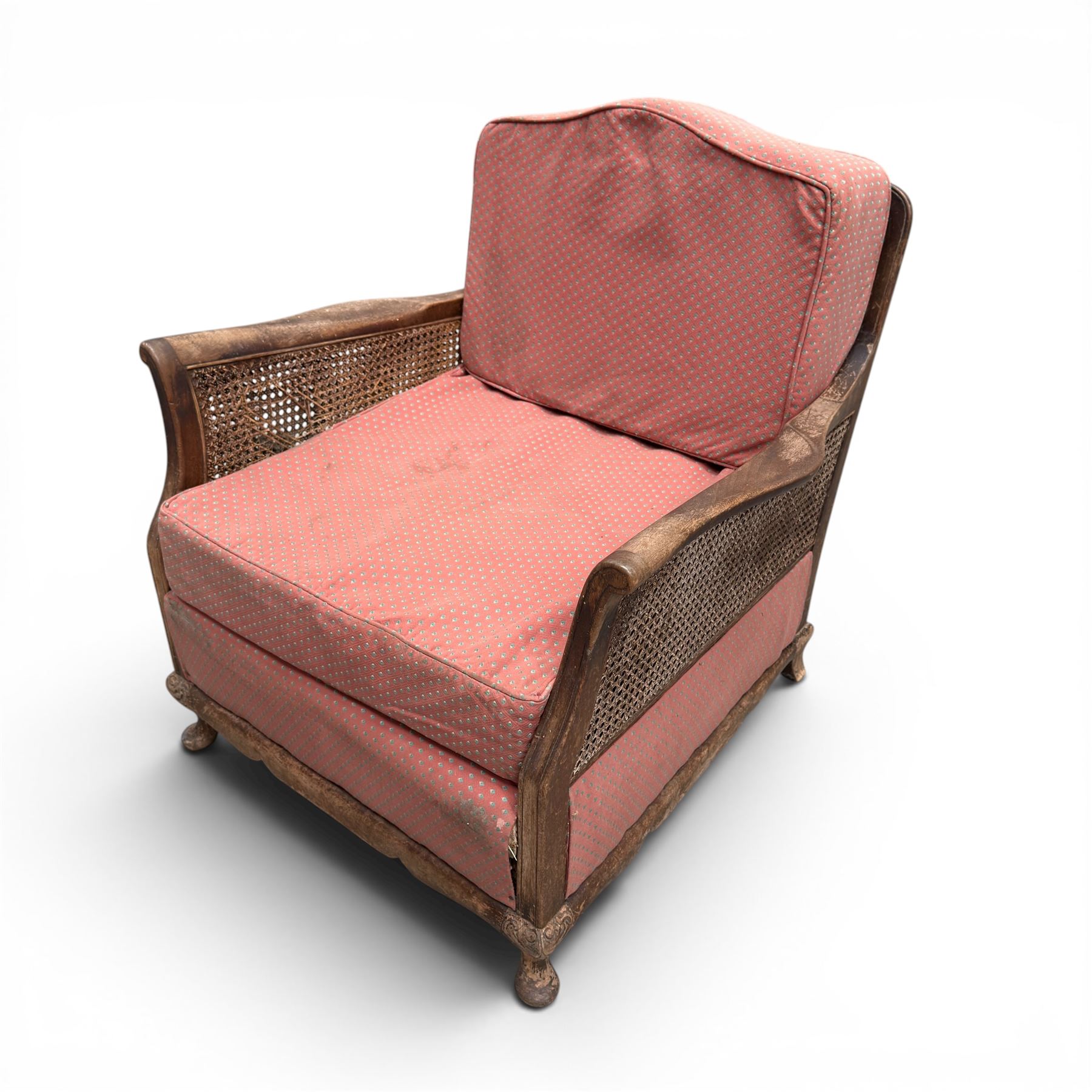 Early 20th century French style bergère conservatory suite, canework back and sides with red upholstered loose seat cushions, on cabriole feet