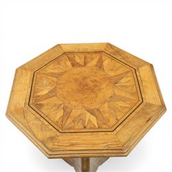 Late Victorian walnut and marquetry occasional table, the octagonal top with moulded edge centred with burr walnut panel within radiating starburst parquetry and line inlaid borders, raised upon a tapering column support with three shaped down swept legs terminating in scroll feet