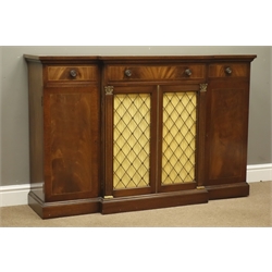  Regency style figured mahogany break front side cabinet, three drawers, centre cupboards with brass grill panels, two single cupboards, on plinth base, W137cm, H89cm, D37cm  
