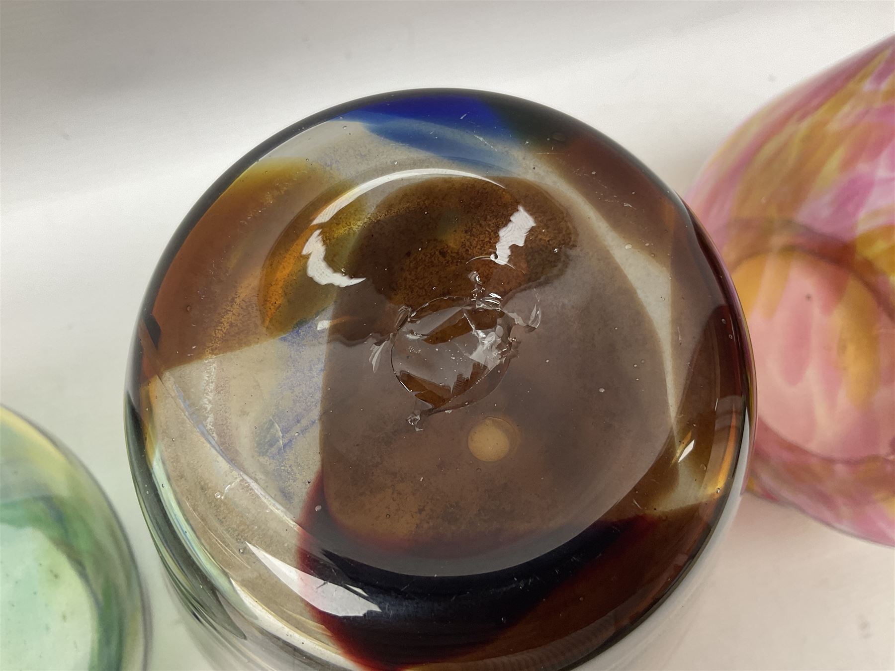 Three Hartley Wood coloured glass vases, each of baluster form with swirling decoration, tallest H21cm