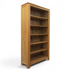 Solid light oak open bookcase, fitted with six open shelves