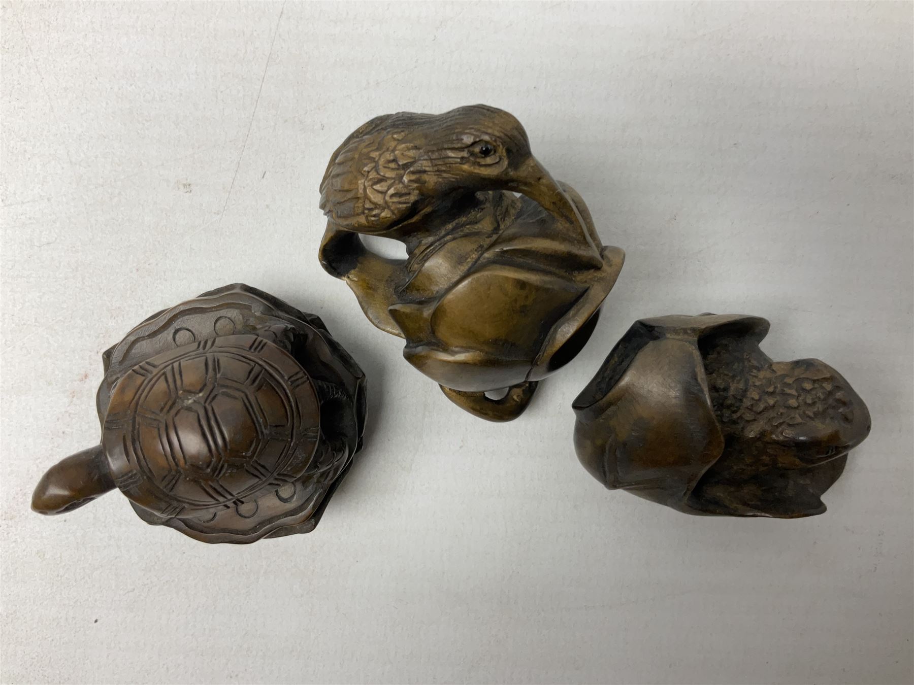 Six netsuke, modelled as a lizard, cricket, frog, bird on a flower, turtle and insect
