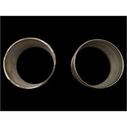 Silver cream jug and two napkin rings, all hallmarked 