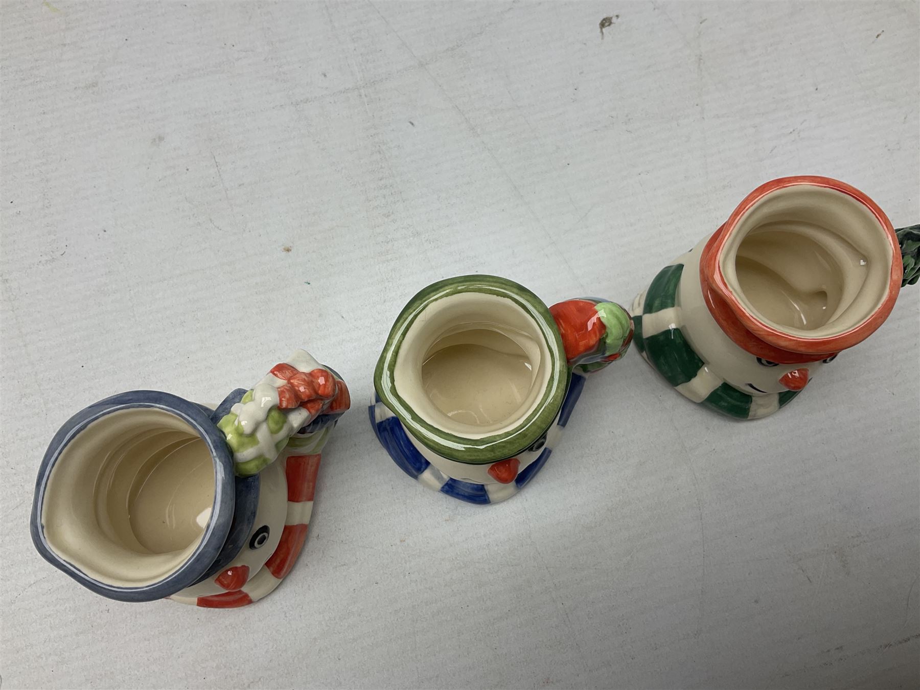 Three Royal Doulton The Mickey Mouse Collection figurines comprising Mickey Mouse MM1, Minnie Mouse MM2, and Goofy MM5, together withe three Royal Doulton limited edition miniature snowman character jugs comprising Christmas Stocking Snowman D7124, Christmas Cracker Snowman D7158 and Snowman D7062, all with original boxes 