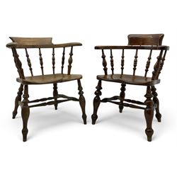 Late 19th century elm smoker’s bow armchair, curved top rails over turned spindle backs, s...