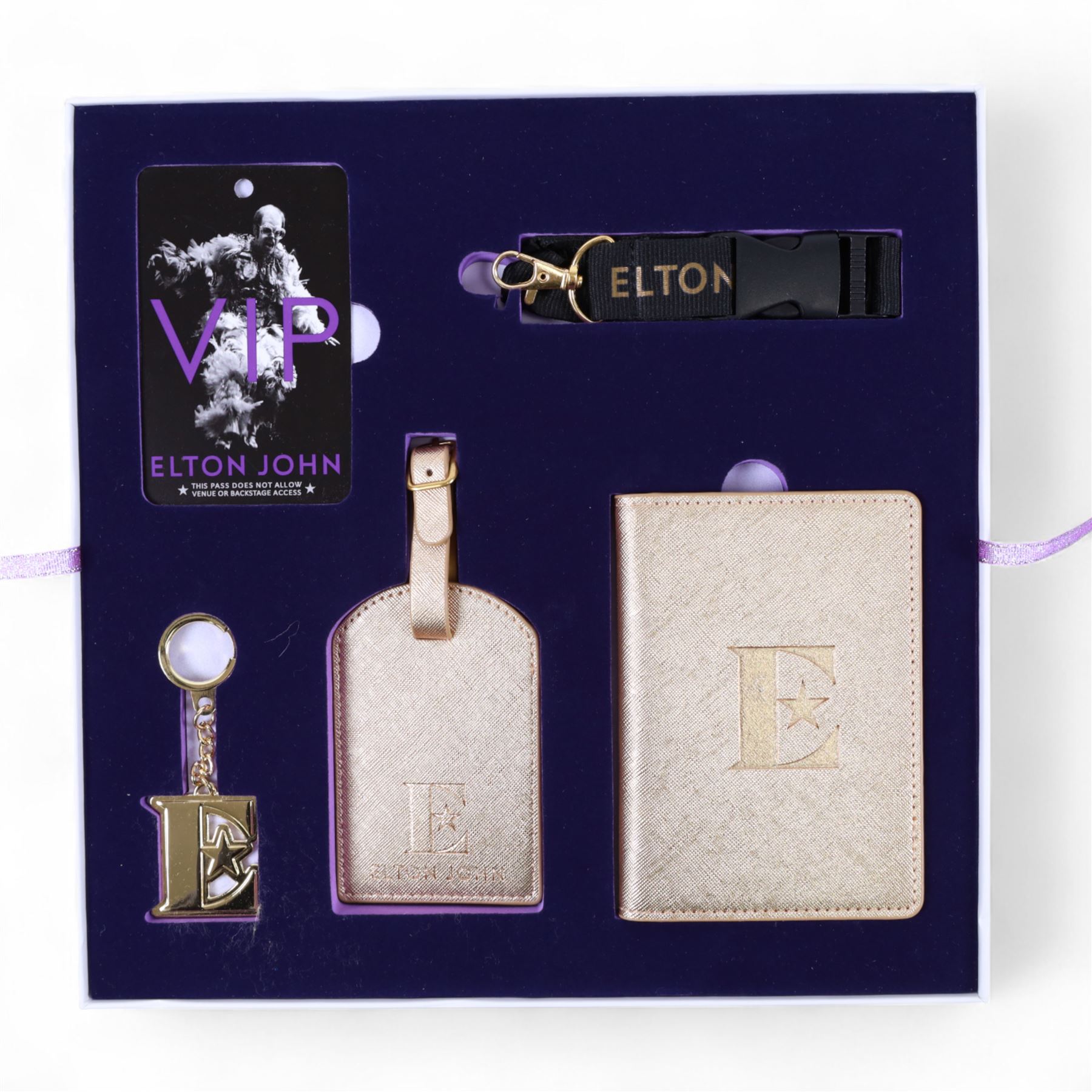 Elton John Farewell Yellow Brick Road tour merchandise, comprising programme, tote bag and VIP giftset with lanyard, wallet, luggage tag and keyring, in white box with gilt lettering, together with two limited edition Farewell Yellow Brick Road lithographs