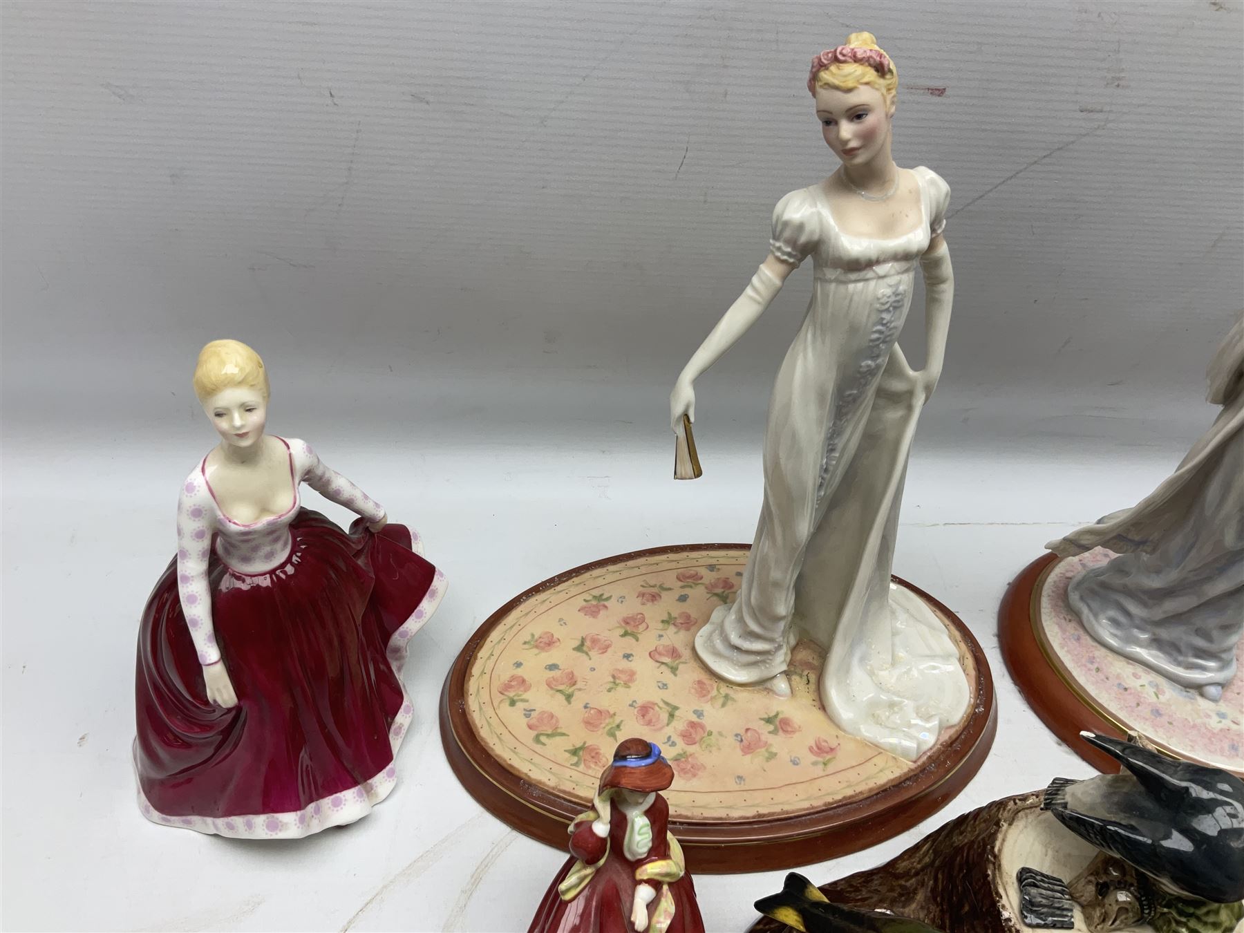 Nine Beswick bird figures, with stand, together with USSR thrush, two Franklin Mint Jane Austin figures and four Royal Doulton figures 