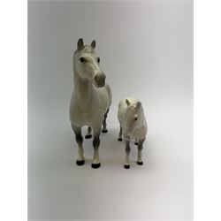 A Beswick figure of a horse, Welsh Cob, model no 1793, together with another similar Beswick example, each with printed marks. (2). 