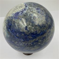 Lapis lazuli sphere upon a carved wooden base 