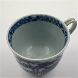Two 18th century Worcester porcelain coffee cups, the first example decorated in the Plantation pattern, circa 1754, the second decorated in the Mansfield pattern, circa 1760, with workman's mark beneath, each approximately H5.5cm