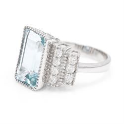 18ct white gold aquamarine and diamond stepped design ring, single milgrain set octagonal cut aquamarine of approx 7.00 carat, with seven round brilliant cut diamonds set either side, stamped 750, total diamond weight approx 0.40 carat