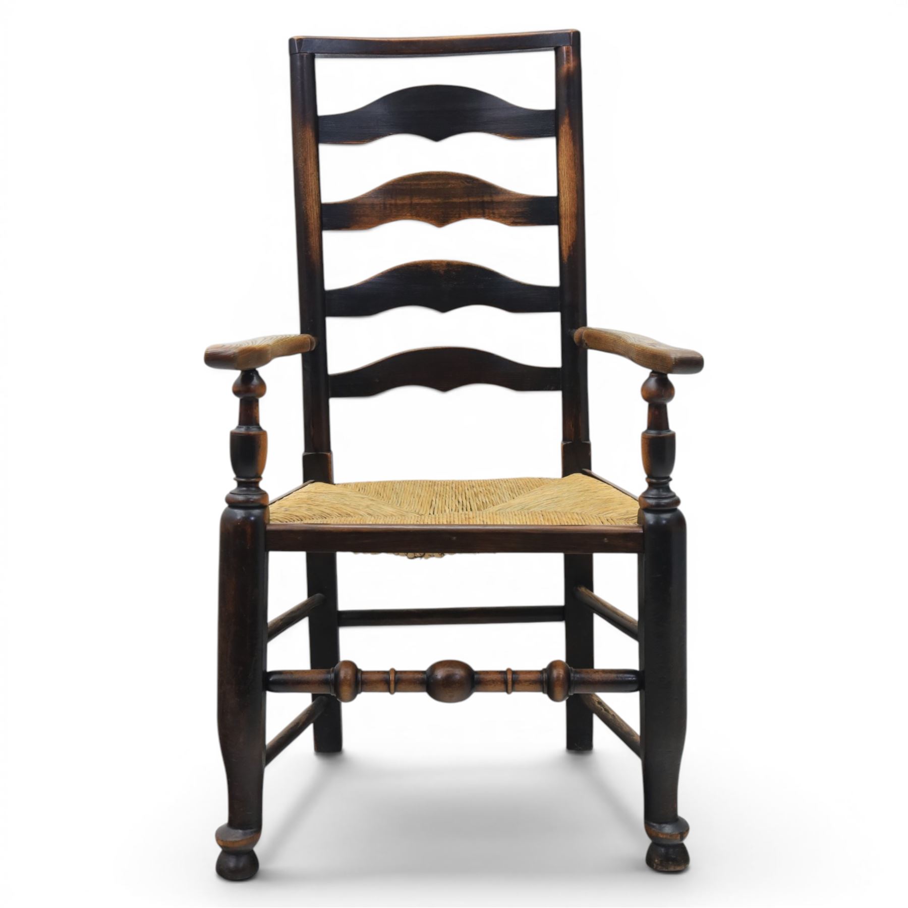 Set of seven (6+1) Georgian design country elm Lancashire dining chairs, ladder backs with rush seats, turned front leg stretcher on pad feet, height of seat 44cm, complete with fitted tie on cushions