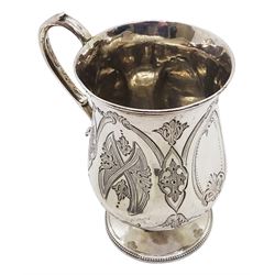 Victorian silver christening mug, of waisted form with scroll handle, the body engraved with strapwork type motifs, upon a circular spreading foot with beaded edge, hallmarked Charles Boyton (II), London 1863, including handle H10cm, approximate weight 3.42 ozt (106.5 grams)