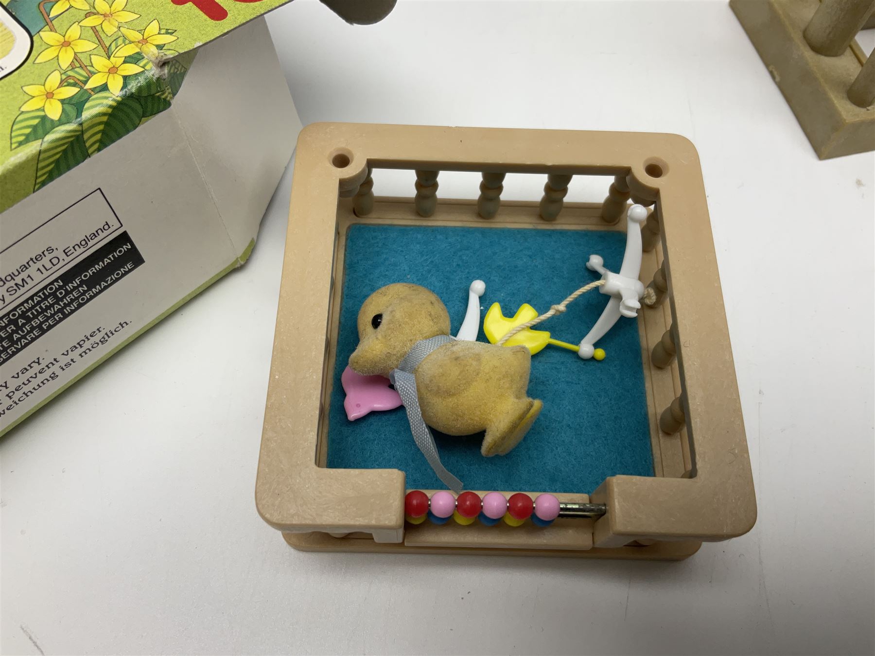 1980s Epoch Sylvanian Families - Country Kitchen Utensil Set and Playpen with Mobile; both boxed; together with assorted loose furniture, playground equipment, grocery shop stock etc; Penny's Pony Club Set in folding stable box; and boxed Bouncin' Babies Nursey Playset