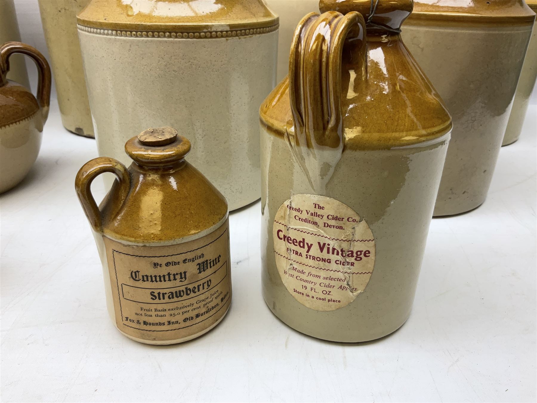 Quantity of salt glazed stoneware flagons, two tone jars and jug etc, to include some with impressed marks and labels, largest H26cm