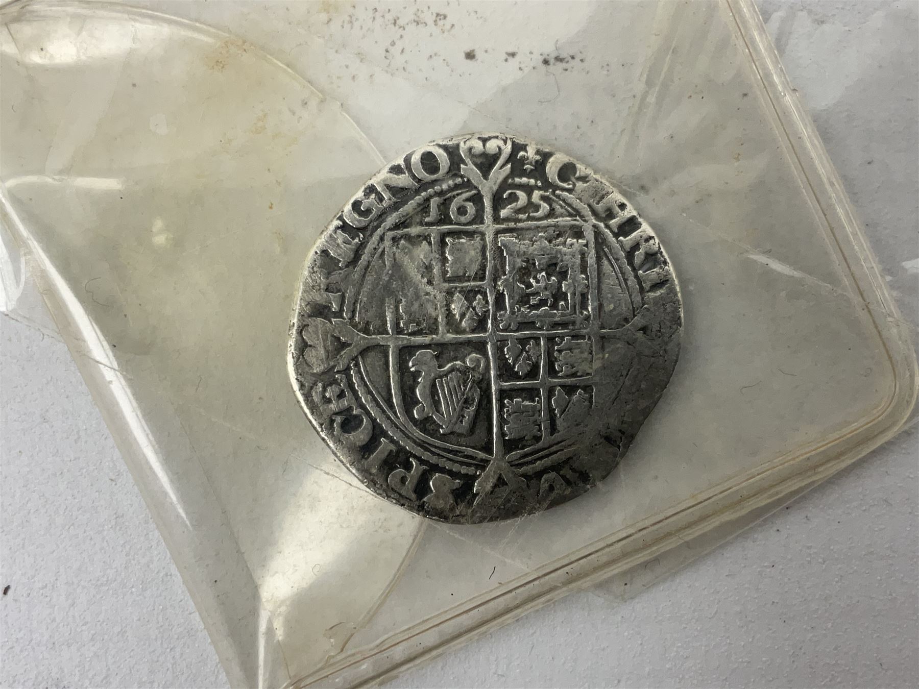 Charles I 1625 hammered silver sixpence, Queen Victoria 1894 crown coin and a cased hallmarked silver medal for the Hull photographic society, engraved '1940' 'Leonard Vokes', all housed in a red Pobjoy Mint coin box