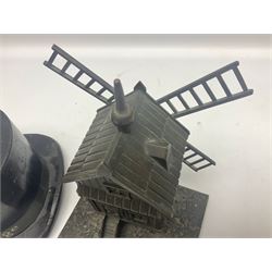 Early 20th century French bronze money bank in the form of a windmill with revolving sails, on oblong base H20cm; and tin-plate 'College' money bank in the form of a top hat by W.M. Livens & Co. Ltd. c1907 L18cm (2)