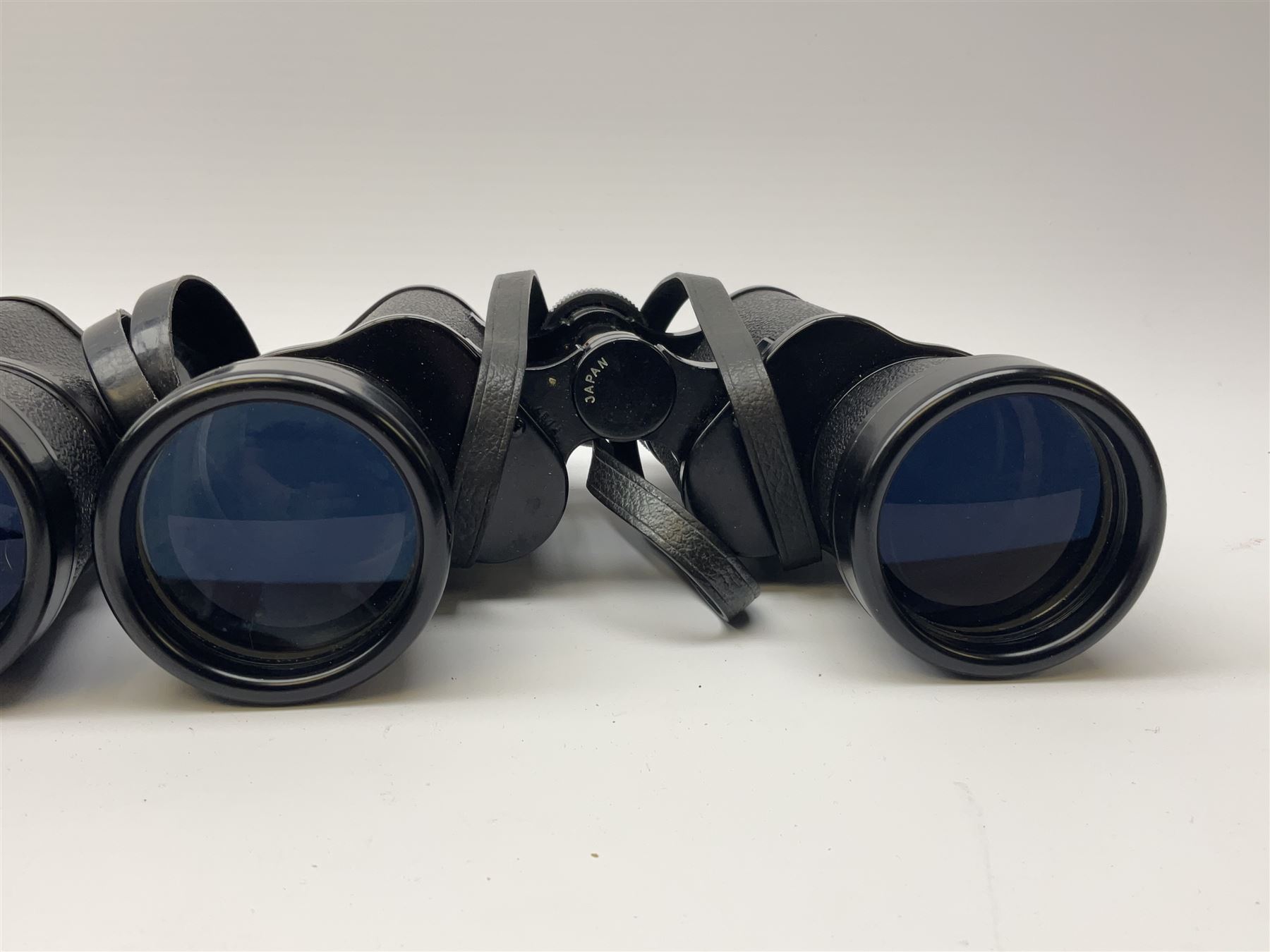 Two pairs of binoculars, Stellar binoculars in case and Tasco binoculars model 306 in case. 