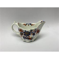 18th century Lowestoft cream jug, circa 1775, the moulded body decorated with floral sprays and sprigs in blue and iron red and heightened with gilt, H5.5cm