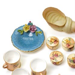Large collection of miniature Royal Worcester hand-painted blush ivory wares, including shell shaped dish, and various covered trinket dishes, in glazed display case