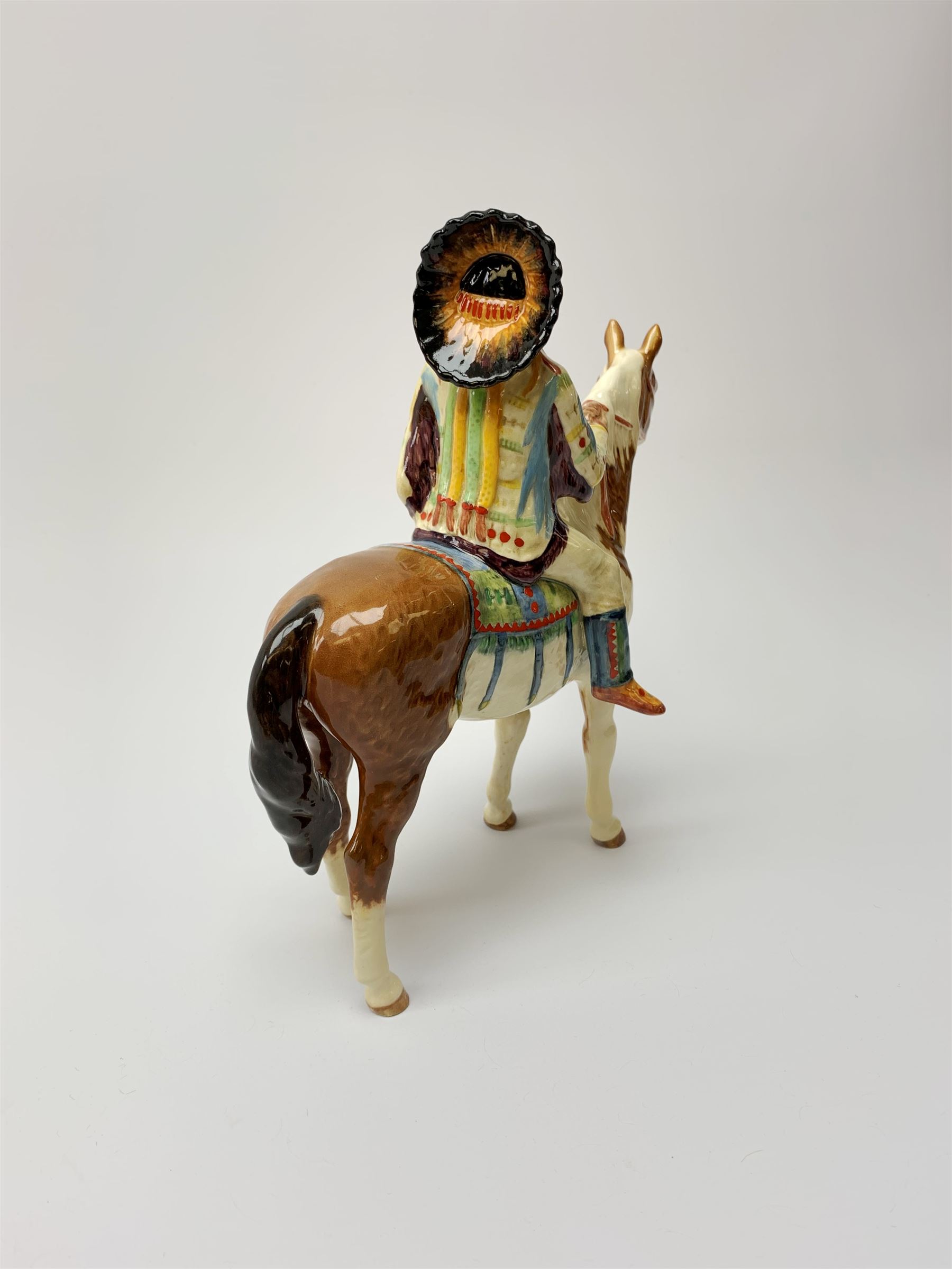 A Beswick Native American on horseback, with printed mark beneath, H21.5cm. 