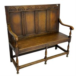 19th century oak settle, lunette carved cresting rail over quadruple panelled back, plank seat, on turned supports joined by stretchers