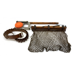 Gamekeeper's wooden game carrier with leather and netting bag under, the swivel handle impressed R. Rudgard, L47cm; Bisley galvanised metal and ash hand clay flinger; and leather 12-bore twenty-five cartridge belt (3)