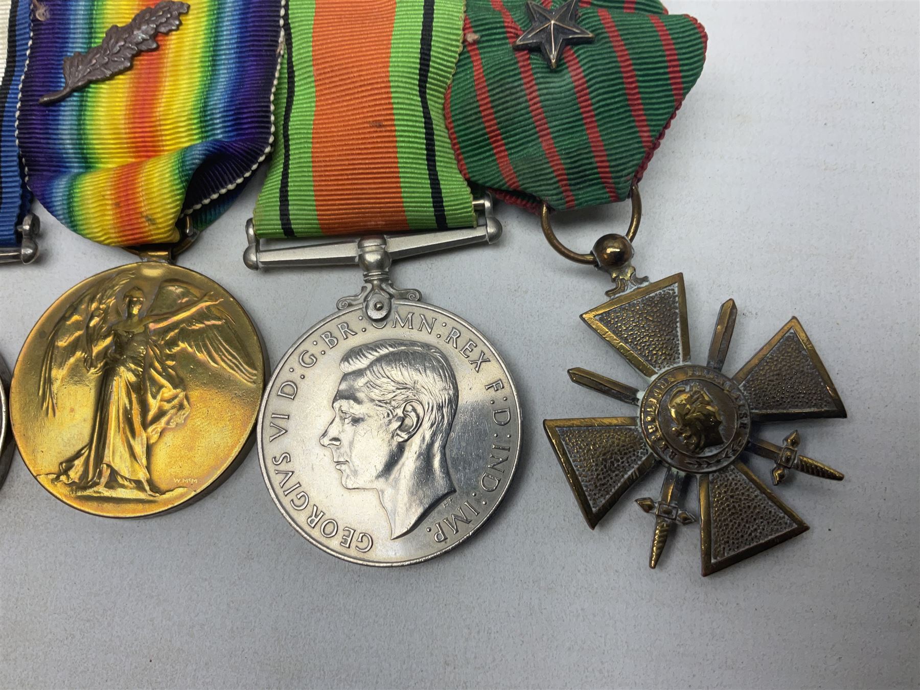 WW1/WW2 Military Cross group of five medals comprising M.C., 1914 Star with date clasp to 34156 Sjt. G. Ferguson R.F.A., British War Medal and Victory Medal with MID leaves to Major G. Ferguson, WW1 French Croix De Guerre with MID Star and WW2 Defence Medal; all with ribbons on pinned wearing bar; WW1 group of five miniature dress medals; two Royal West Kent cap badges; early 20th century silver cigarette case engraved with GF monogram and adapted as a photograph holder with image of Ferguson in civilian clothing; presentation Rotary 9ct gold cased wrist-watch with 1931 British Legion inscription verso; and archive of ephemera including 1914 MID certificate; WW2 Home Guard certificate; over twenty career spanning photographs of Regimental groups, portraits, Sandhurst etc; 1914 Commission document to 2nd Lieutenant; 11th Brigade R.F.A. Roll of Honour 1914-18; 'Soldier's Small Book'; Army Book 439 etc