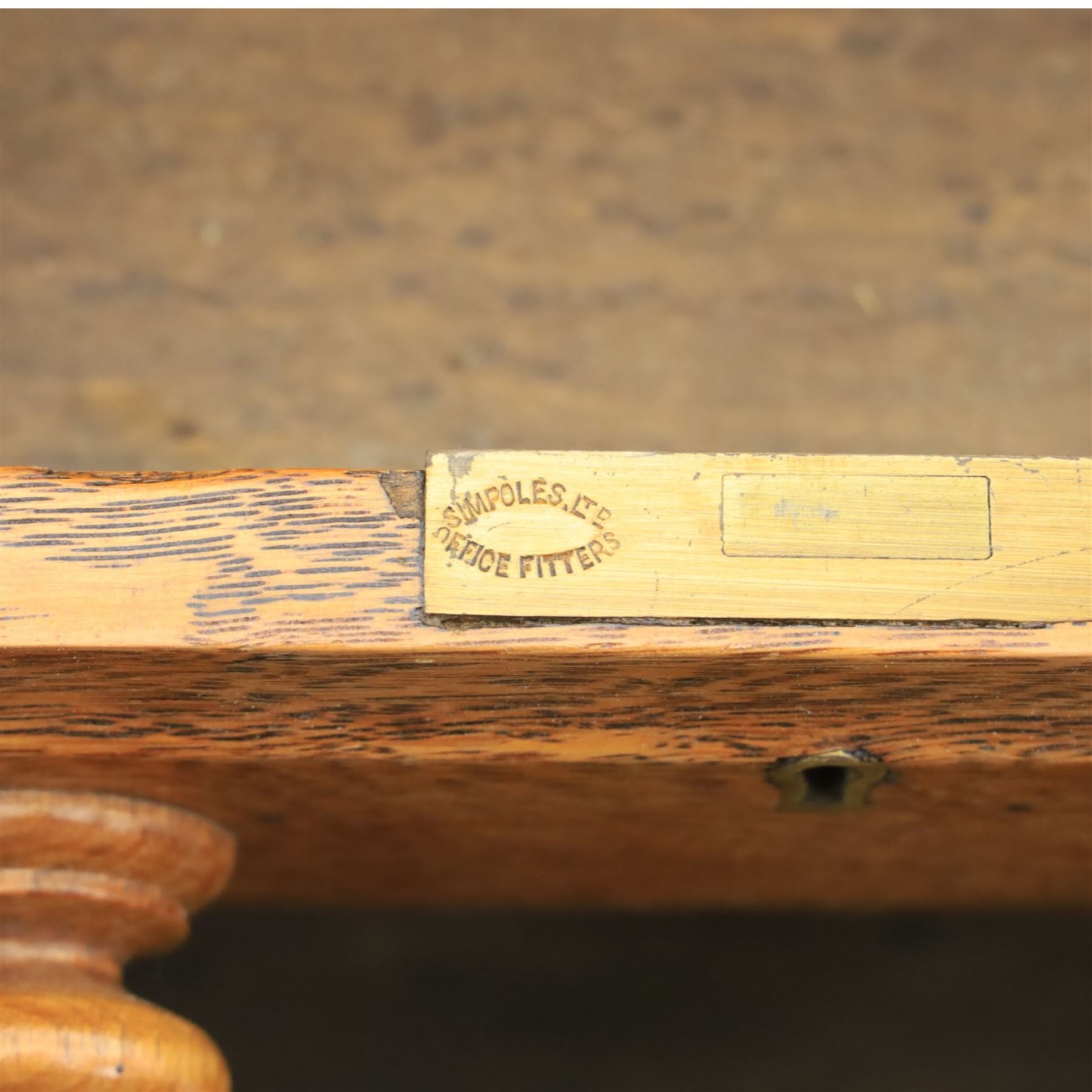 20th century oak compact pedestal desk, tooled green leather inset top, above a single frieze drawer, with a bank of four graduated drawers and a drawer and cupboard, panelled sides raised on castors