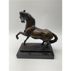 Bronze figure modelled as a prancing horse, upon a naturalistically modelled rectangular base, and black marble plinth, H34.5cm, W16cm, L32cm