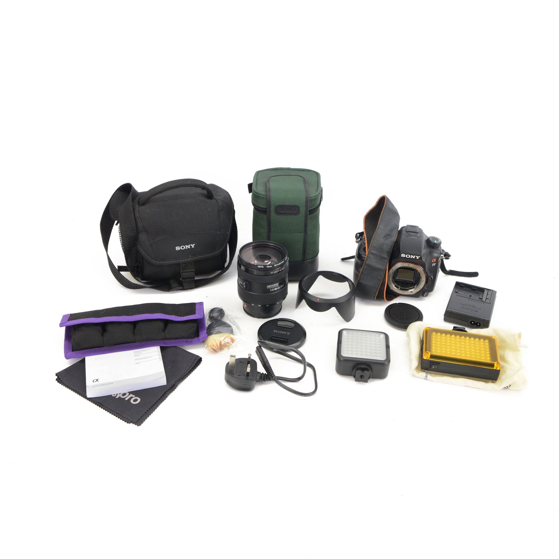 Sony Alpha A77 digital SLT camera body serial no. 0715628, with a Sony DT 2.8/16-50 SSM lens, serial no. 1810590, boxed with soft shell carry case, charger and instructions