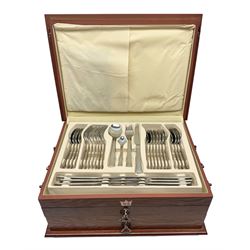 Waltmann und Sohn part canteen of stainless steel and gilt cutlery, the stained wood case with hinged lid above two fitted drawers, L48cm