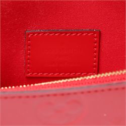 Louis Vuitton - ‘Lucy’ pochette in Cerise red Monogram Vernis leather, the structured envelope-form body with gold-tone press-stud fastening, opening to a red fabric-lined interior with central zipped compartment and two gusseted open pockets, with care card, dust bag and box