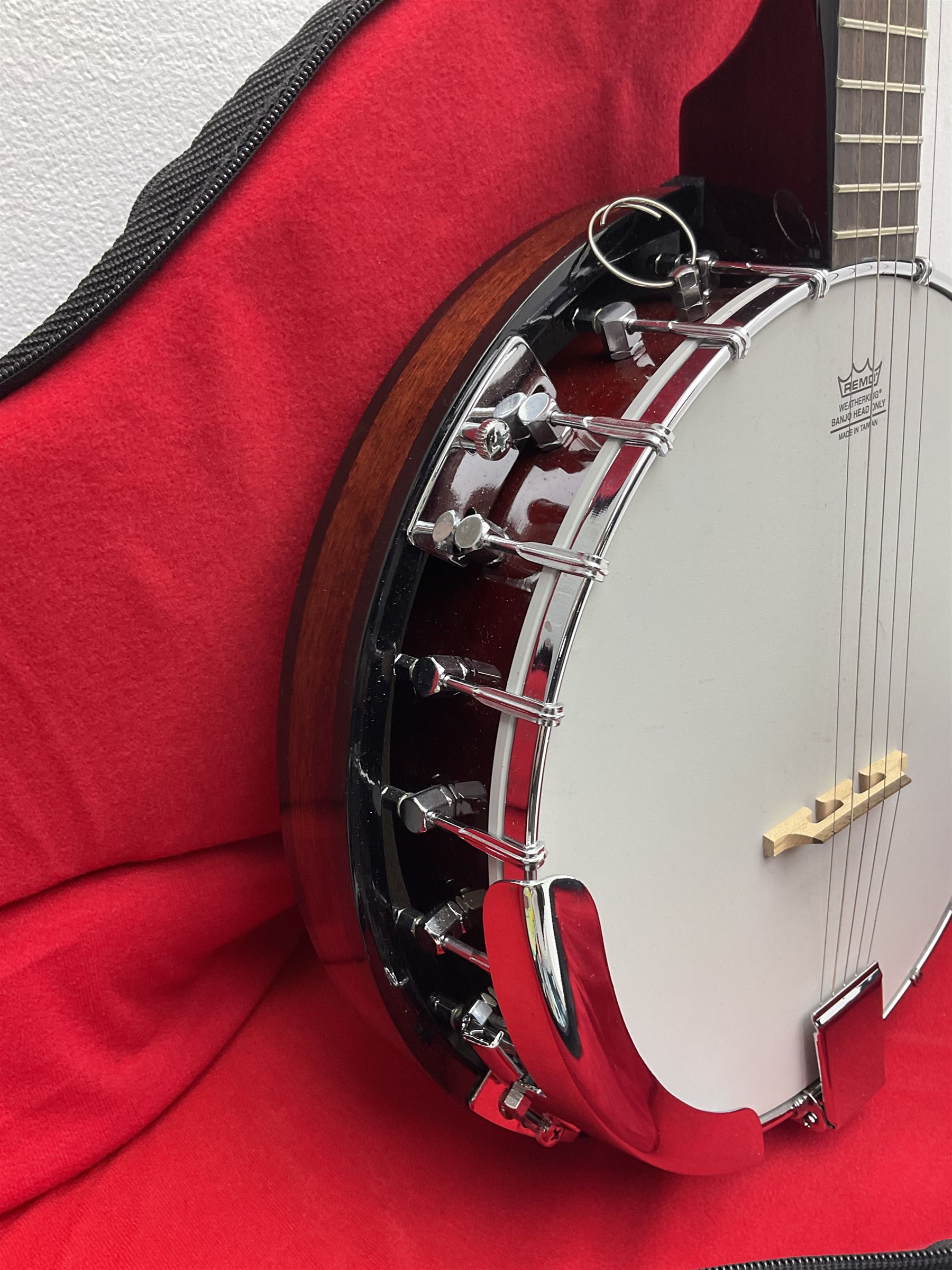 Rally five-string banjo with mahogany solid back L101cm in soft carrying case; and Brunswick Model BF200 acoustic guitar L103cm; with small quantity of instructional DVDs and booklets